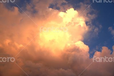 Sun throuht clouds. Bright multi colored sunset clouds in the sky.