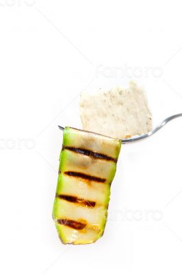grilled zucchini courgette with cracker on a fork