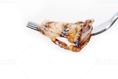 grilled onion on a fork