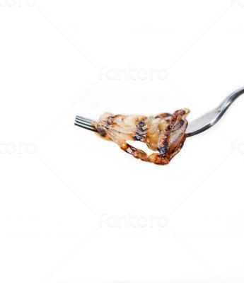 grilled onion on a fork