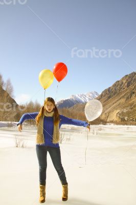 Fun girl with balloons on the hair 