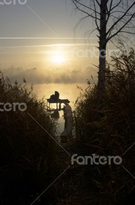 Foggy morning landscape in the autumn park near the lake. Vintag