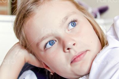 Cute girl with big blue eyes