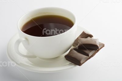 Cup of hot tea with dark chocolate