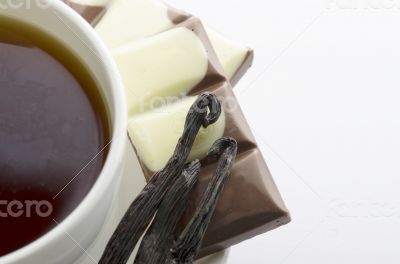 Cup of hot tea with dark chocolate