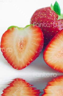 Healthy red strawberry fruit sliced isolated on the white backgr