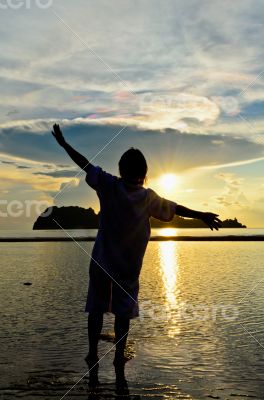 Women happy sunrise at the beach