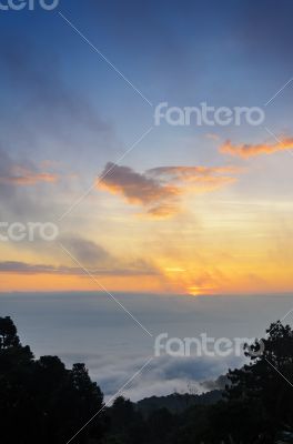 Colorful sunrise above the clouds