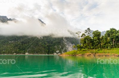 Beautiful high mountains and green lake