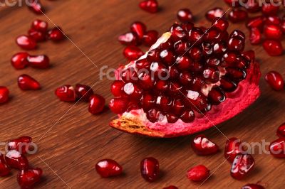 Single Pomegranate Part on the Wood