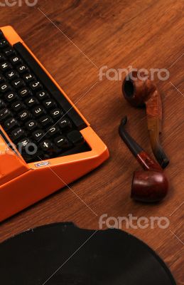 The Orange Vintage Typewriter on the Wood