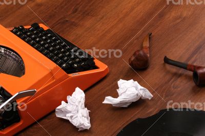 The Orange Vintage Typewriter on the Wood