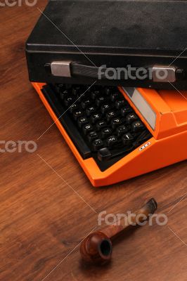 The Orange Vintage Typewriter on the Wood