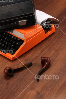The Orange Vintage Typewriter on the Wood