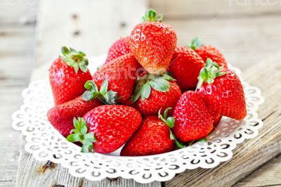 plate with fresh strawberries