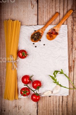 uncooked pasta with tomatoes and spices 