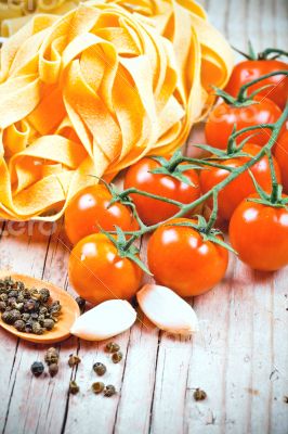 uncooked pasta, fresh tomatoes and spices 