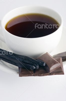 Cup of hot tea with dark chocolate