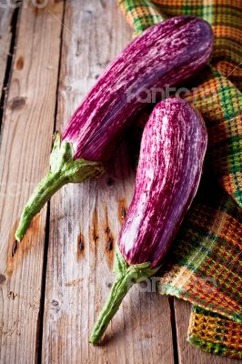 two fresh eggplants