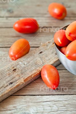 fresh tomatoes in metal bowl 