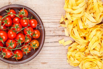 uncooked pasta and fresh tomatoes