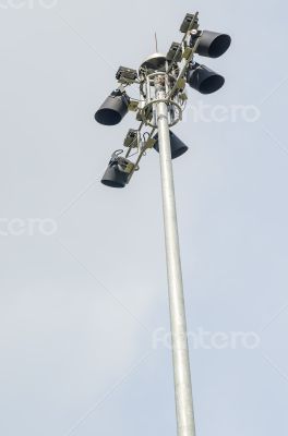 spotlights post on white cloudy