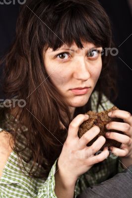 beggar woman with a piece of bread 