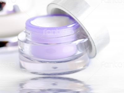 Closeup of jar of moisturizing face cream. Open container of cre