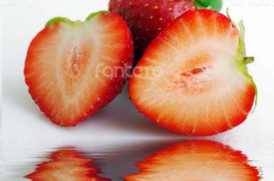 Healthy red strawberry fruit sliced isolated on the white backgr