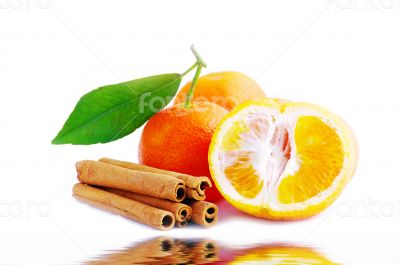 Tangerine with cinnamon on a white background