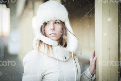 Winter girl in warm clothes snowy day