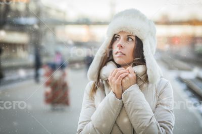 Young woman feeling cold in winter day