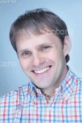 Smiling young man wearing cowboy shirt