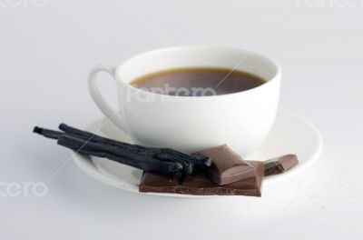 Cup of hot tea with dark chocolate 