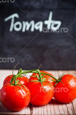 fresh tomatoes and blackboard 