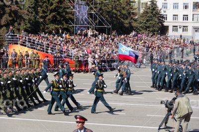 Russian soldiers march at the parade