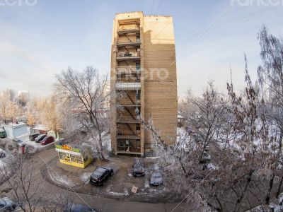 A view from the window on the winter city and houses  by fisheye view