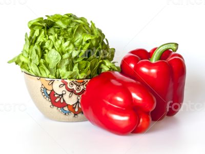 Two large red paprikas and bunch of fresh salad