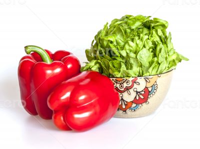Two large red paprikas and bunch of fresh salad