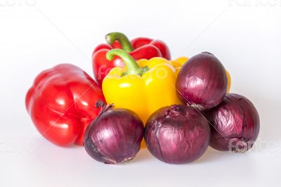 Large red and yellow paprikas and red onions