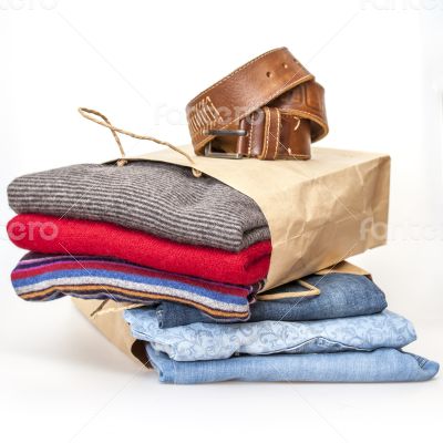 Shopping: jumper and jeans in paper packages