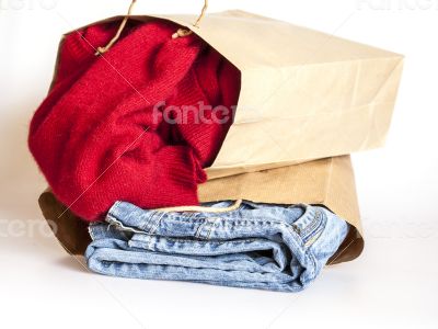 Shopping: jumper and jeans in paper packages