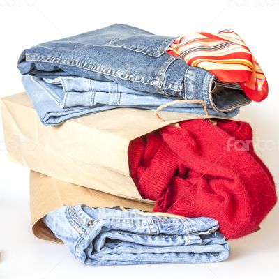 Shopping: jumper and jeans in paper packages