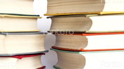 Two piles of vintage paper books