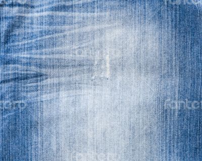 Texture of threadbare denim of indigo color