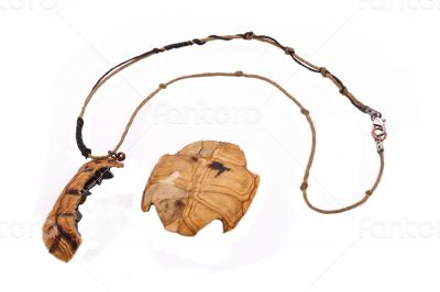 The turtle necklace on the white background