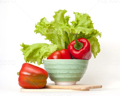 Large red paprika and bunch of fresh salad