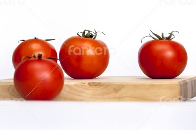Red juicy tomatoes on the table
