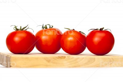 Red juicy tomatoes on the table