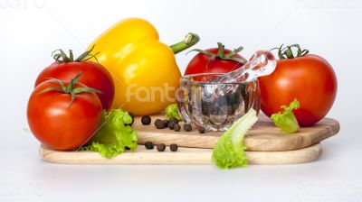 Sweet pepper of yellow color and ripe tomatoes